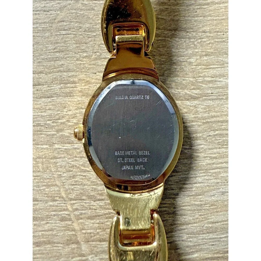 Vtg Caravelle by Bulova Quartz Womens Oval Watch Two Tone Black Face Rhinestones